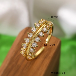 Detail view of gold geometric adjustable ring with cubic zirconia inlay and size specs