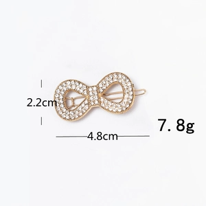 Detail of crystal butterfly hair clip showing dimensions 4.8cm width and 2.2cm height