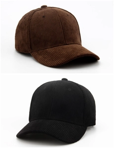 Detailed texture of brown and black corduroy baseball caps showing retro fabric quality