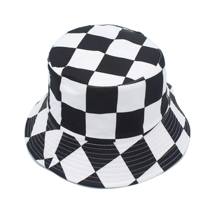 Close-up of the black and white checkerboard pattern on the reversible cotton bucket hat
