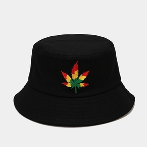 Close-up of vibrant red, yellow, and green leaf embroidery on black canvas bucket hat