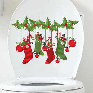 Christmas toilet lid sticker featuring festive socks, ornaments and holly leaf motifs