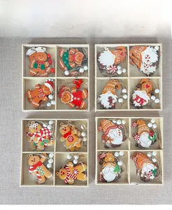 Detailed view of wooden gingerbread man and gnome Christmas ornaments in a grid box