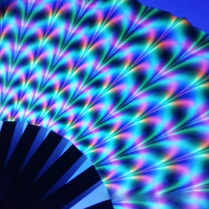 Detail of vibrant rainbow folding fan with UV holographic effect and black bamboo ribs