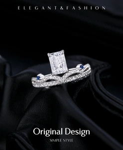 Macro view of a silver crown ring with a rectangular gemstone and blue accents