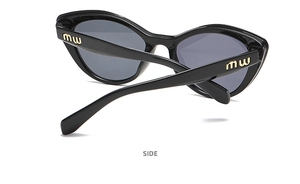 Detailed side view of black cat-eye sunglasses with gold metal logo on the temple