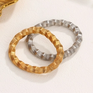 Twisted cable cuff bracelets in gold and silver plating made of stainless steel