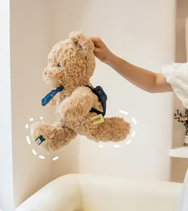 Detail of teddy bear showing gravity granules for stability and a denim backpack