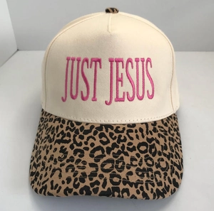 Close-up of pink JUST JESUS embroidery on beige crown with leopard print brim