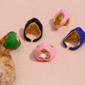 Detailed view of 18K gold plated heart gemstone rings with colorful enamel finishes