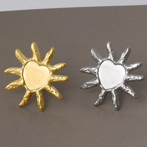 Detail of 304 stainless steel heart sun stud earrings with hammered gold and silver texture