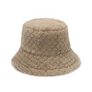 Plush beige quilted bucket hat made of warm faux lamb wool for autumn and winter
