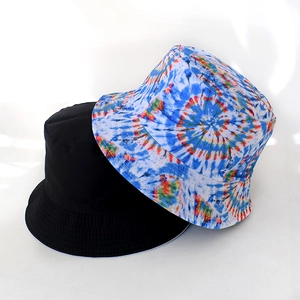Detail of vintage fisherman hats in solid black and vibrant blue-orange tie-dye print