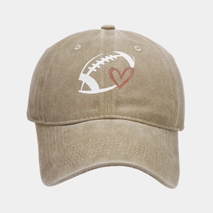 Close-up of vintage khaki baseball cap featuring football heart print and stitching