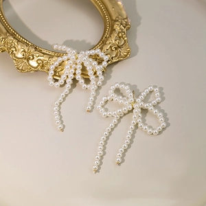 Elegant white pearl bowknot tassel earrings with long dangling pearl strands for women
