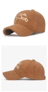 Detail of brown faux shearling baseball cap with white La BroD 3D embroidery texture