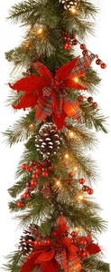 Detailed Christmas wreath with pine needles, red berries, cones and LED lights