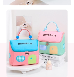 Detail of house-shaped makeup bags with pearl handles and cute window patchwork design