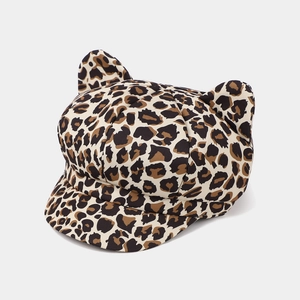 Detailed macro view of leopard print cat ear newsboy hat featuring textured fabric and ears