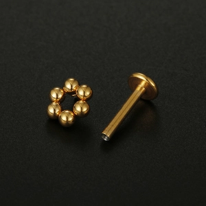 Golden flower labret stud made of 16G surgical stainless steel for lip and ear piercings