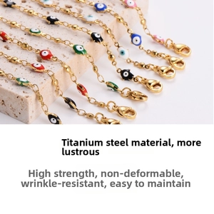 Macro detail of titanium steel evil eye bracelets with colorful enamel and gold plating