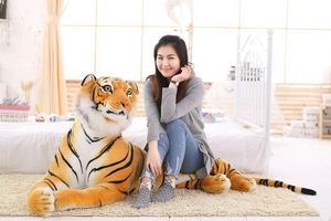 Detail of life-sized plush tiger skin shell with realistic stripes and soft long faux fur
