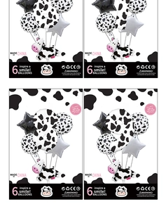 Detail of cow-themed number balloon set with latex stars and spots for birthday party decor