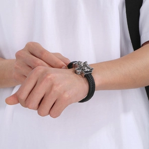 Punk woven leather bracelet for men with vintage steel wolf head clasp on model