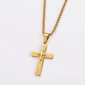 Detail of gold-plated stainless steel cross pendant featuring engraved Spanish Lord's Prayer