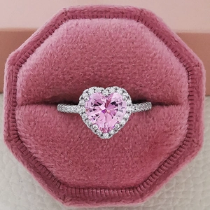 Romantic pink heart-shaped gemstone ring in halo setting with premium velvet box