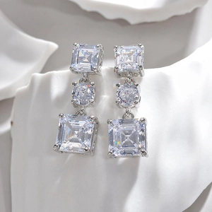 Elegant three-tier drop earrings with emerald cut cubic zirconia in silver-tone finish
