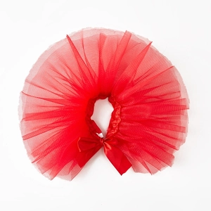 Detail of red tiered nylon tulle dog tutu skirt with matching satin ribbon bow accent