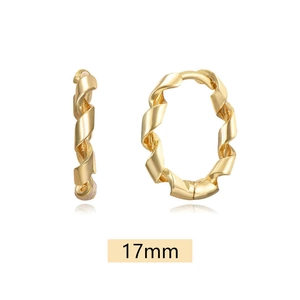 Detailed close-up of 17mm gold twisted hoop earrings with a textured ribbon design