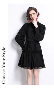 Detail of elegant black dress showing intricate lace patchwork and lantern sleeves on a mannequin