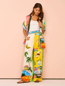 Detail of summer vacation set showing patterned shirt and wide-leg pants on a model