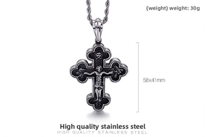 Detail view of vintage crucifix pendant in stainless steel with relief engraving, 58x41mm