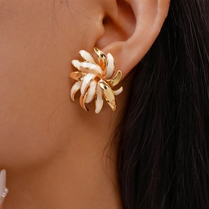 Fashionable 18K gold plated flower stud earrings featuring white enamel floral petals