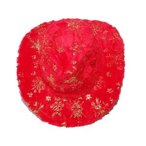 Detail shot of the red plush Christmas cowboy hat with golden snowflake pattern textures