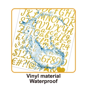 Macro shot of gold glitter vinyl stickers showing waterproof surface with water droplets