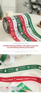 Detail of 2.5cm Christmas ribbon with gold stamping patterns and festive lettering