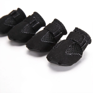 Detailed macro view of breathable mesh dog sandals with adjustable Velcro straps