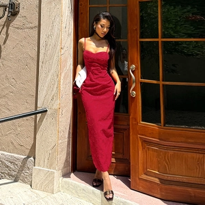 Elegant red backless bodycon maxi dress with textured fabric on a fashion model