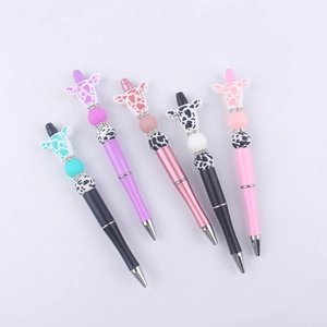 Detail of colorful DIY beaded pens with cute cartoon animal heads and rhinestone rings