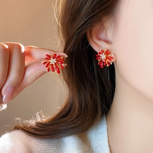 Elegant red coral fireworks earrings with sparkling crystals and a golden flower center