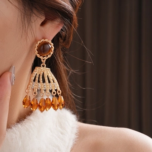 Vintage gold tassel earrings with amber gemstone and sparkling zircon accents