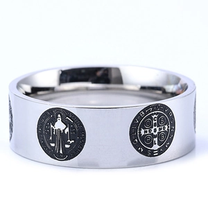 Polished stainless steel band ring featuring vintage St. Benedict religious cross medals