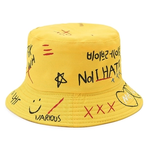Streetwear yellow bucket hat with artistic hand-drawn graffiti and letter prints