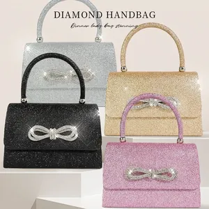 Sparkling evening clutch bag with rhinestone bow detail in silver, gold, black and pink