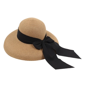 Straw sun hat with wide brim and black silk bow for summer UV protection