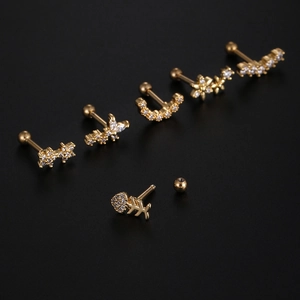 Set of gold stainless steel cartilage earrings with zircons in star and butterfly shapes